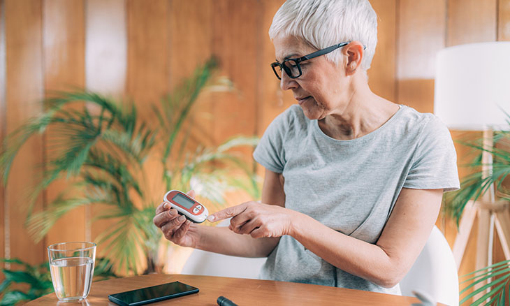 Woman checking her blood pressure.