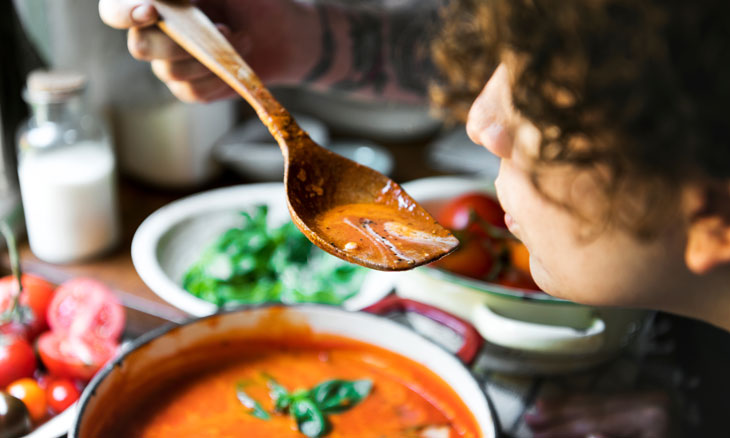 Woman tastes health fall soup