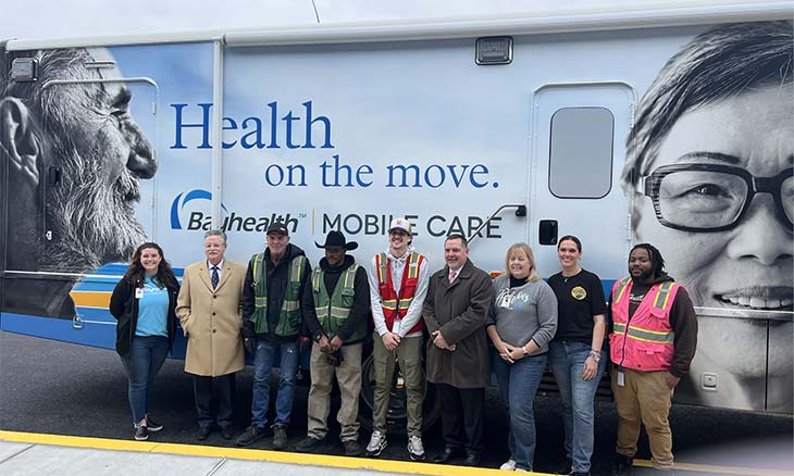 Bayhealth staff stand in front of the Mobile Care Unit