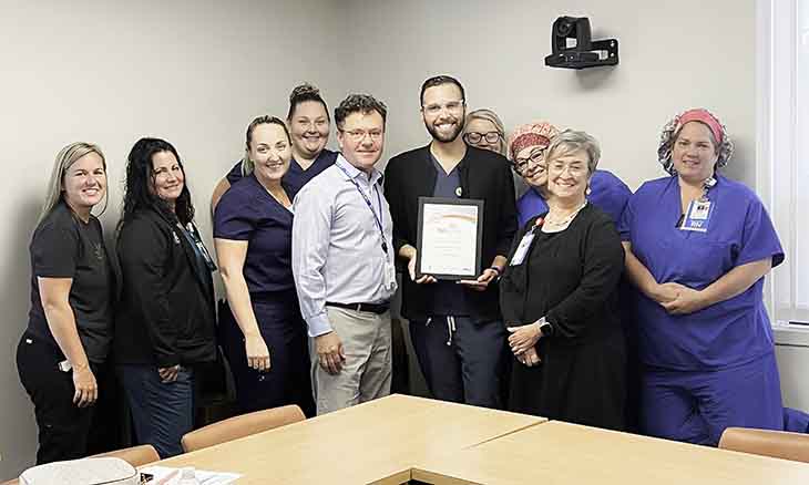 Bayhealth staff pose with award.