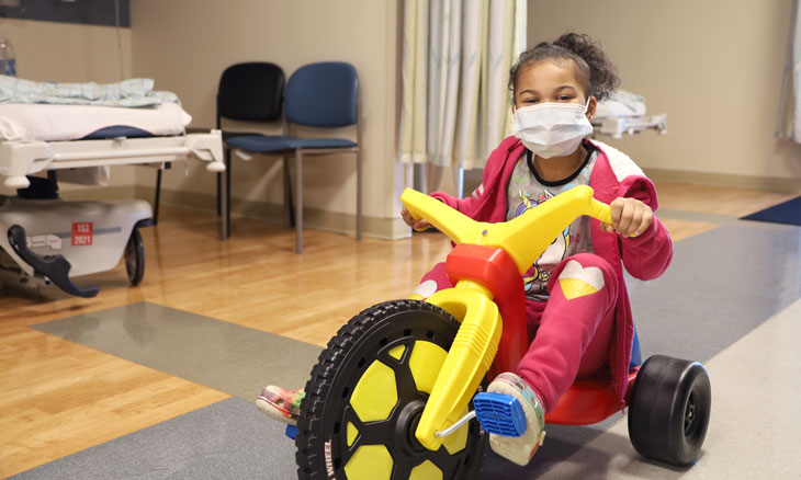 Child riding tricycle