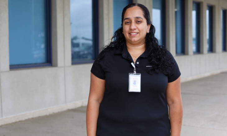 A Bayada employee poses outside her building.